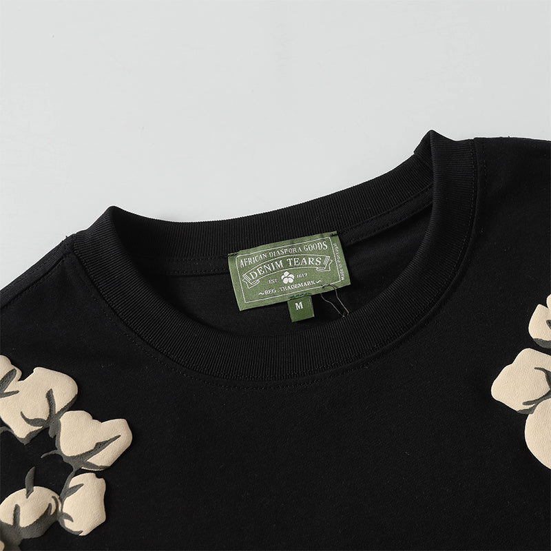 Denim Tears Black Oversized Short Sleeve Tee With All Over Beige Flower Wreath Print